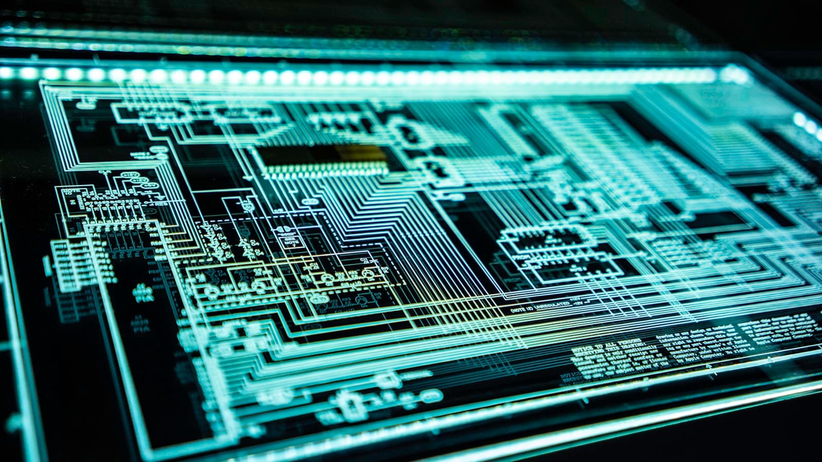 Illuminated electronic circuit representing cybersecurity and digital infrastructure
